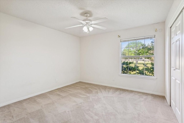 211 Partners Rd, Woodway, TX 76712 - carpeted empty room with a textured ceiling, ceiling fan, and baseboards