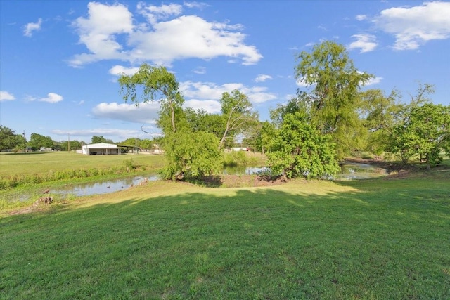 211 Partners Rd, Woodway, TX 76712 - view of grassy yard featuring a water view