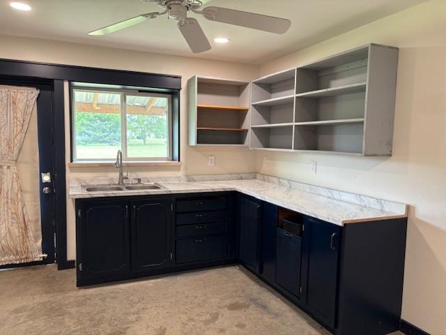 211 Partners Rd, Woodway, TX 76712 - kitchen with a sink, ceiling fan, light colored carpet, recessed lighting, and dark cabinetry