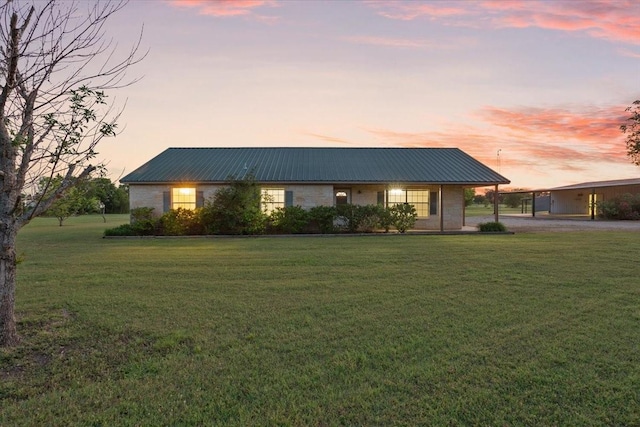 211 Partners Rd, Woodway, TX 76712 - view of front of property with metal roof, a lawn, and a carport