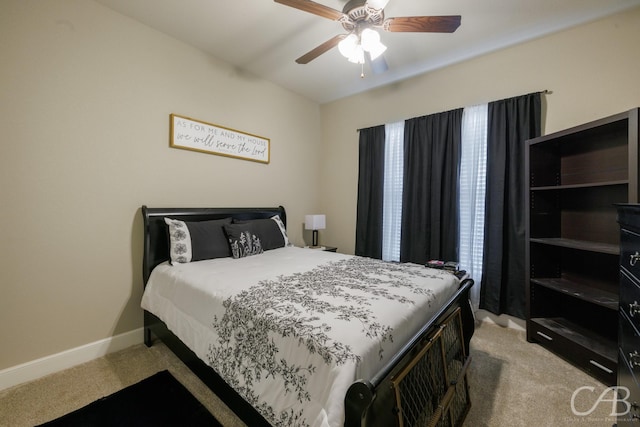 6833 Inverness St, Abilene, TX 79606 - bedroom with light colored carpet, baseboards, and ceiling fan