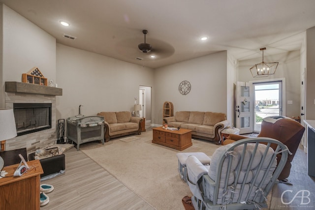 6833 Inverness St, Abilene, TX 79606 - living room featuring a fireplace, ceiling fan, wood finished floors, a chandelier, and recessed lighting
