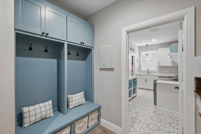 7747 Barber Ranch Rd, Fort Worth, TX 76126 - mudroom featuring a sink and baseboards