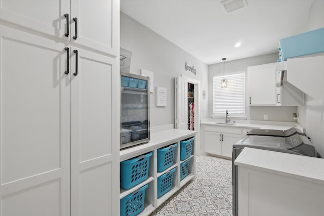 7747 Barber Ranch Rd, Fort Worth, TX 76126 - kitchen featuring a sink, white cabinetry, pendant lighting, and light tile patterned flooring