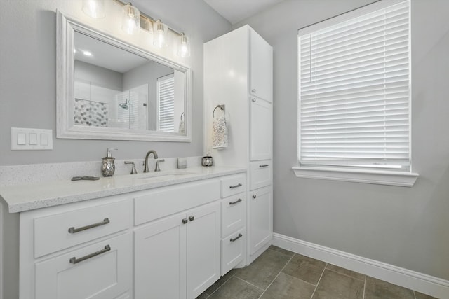 7747 Barber Ranch Rd, Fort Worth, TX 76126 - full bath with baseboards, a tile shower, vanity, and tile patterned floors