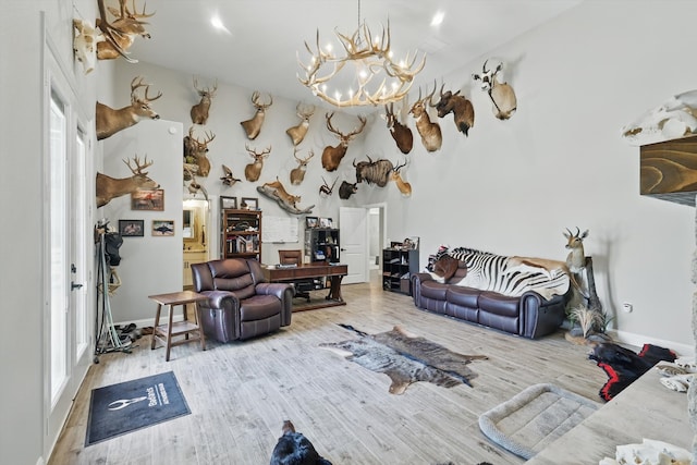 7747 Barber Ranch Rd, Fort Worth, TX 76126 - living room featuring a chandelier, wood finished floors, and plenty of natural light