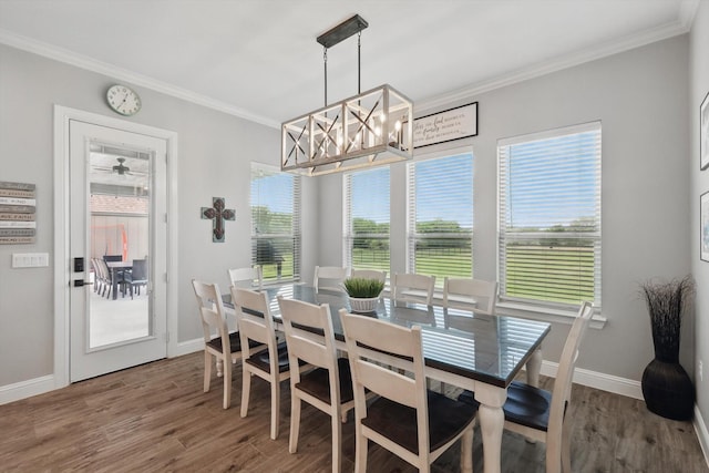 7747 Barber Ranch Rd, Fort Worth, TX 76126 - dining space featuring ornamental molding, wood finished floors, baseboards, and a chandelier