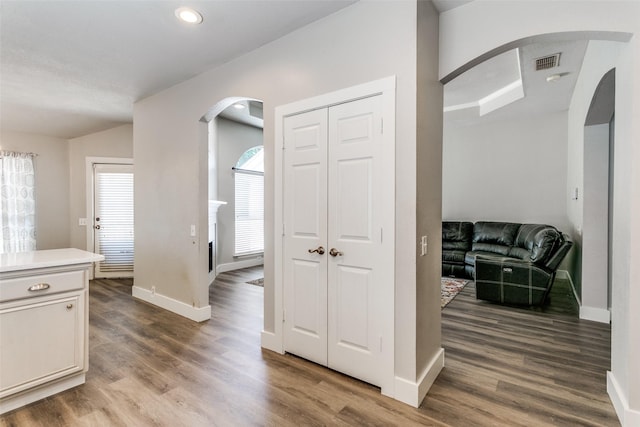 7209 Coventry Cir, North Richland Hills, TX 76182 - hallway featuring arched walkways, baseboards, wood finished floors, and recessed lighting