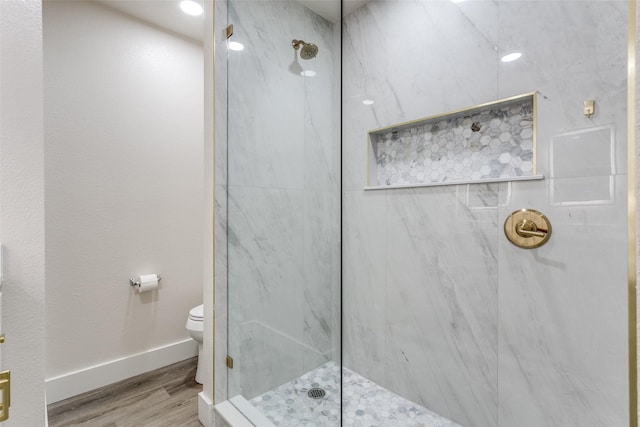 7209 Coventry Cir, North Richland Hills, TX 76182 - full bathroom with wood finished floors, toilet, a marble finish shower, and baseboards