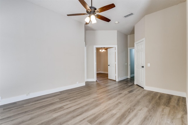 7209 Coventry Cir, North Richland Hills, TX 76182 - spare room with a ceiling fan, light wood finished floors, lofted ceiling, and baseboards
