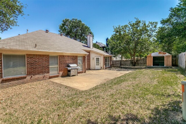 7209 Coventry Cir, North Richland Hills, TX 76182 - back of house with a patio area, brick siding, a chimney, and a shed
