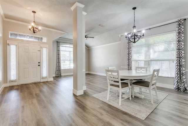 7209 Coventry Cir, North Richland Hills, TX 76182 - dining room featuring a chandelier, ornamental molding, baseboards, and wood finished floors