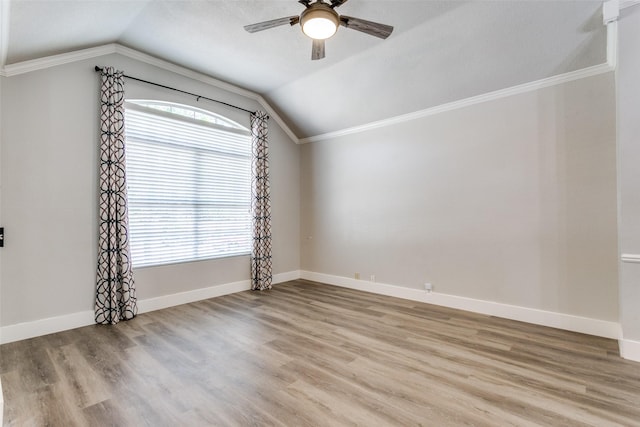 7209 Coventry Cir, North Richland Hills, TX 76182 - empty room with lofted ceiling, ceiling fan, wood finished floors, baseboards, and crown molding