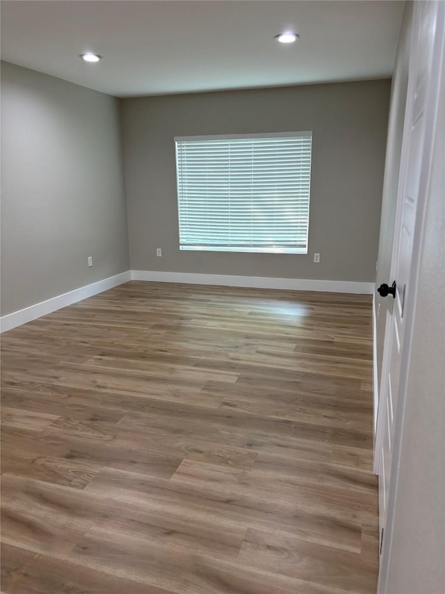 3214 51st St, Dallas, TX 75216 - spare room with baseboards, recessed lighting, and wood finished floors