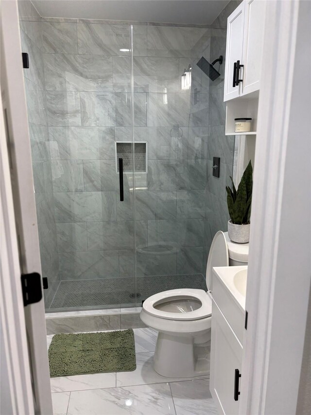 3214 51st St, Dallas, TX 75216 - full bath featuring marble look tile flooring, toilet, vanity, and a stall shower