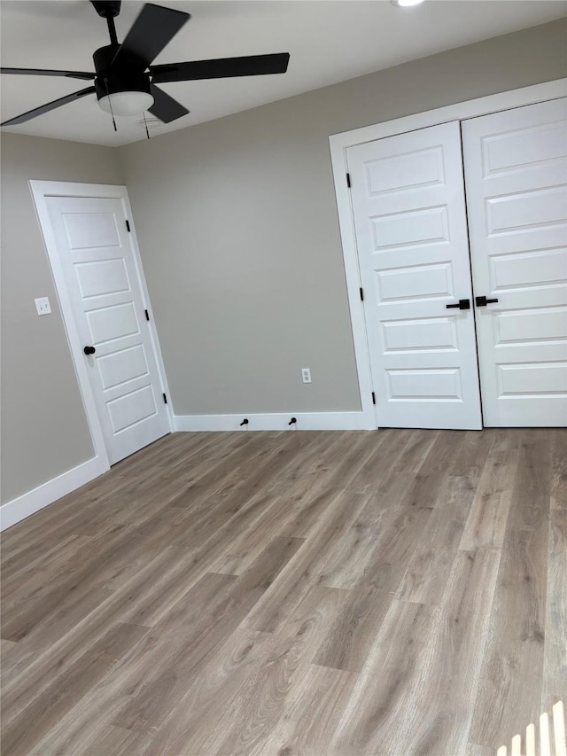 3214 51st St, Dallas, TX 75216 - unfurnished bedroom with wood finished floors, baseboards, and a closet