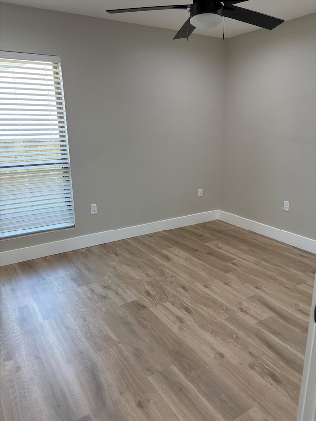 3214 51st St, Dallas, TX 75216 - empty room featuring a ceiling fan, light wood-style flooring, and baseboards