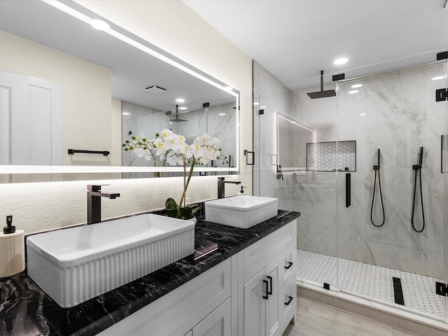 6622 Symphony Dr, Dallas, TX 75227 - full bath with a marble finish shower, double vanity, and recessed lighting