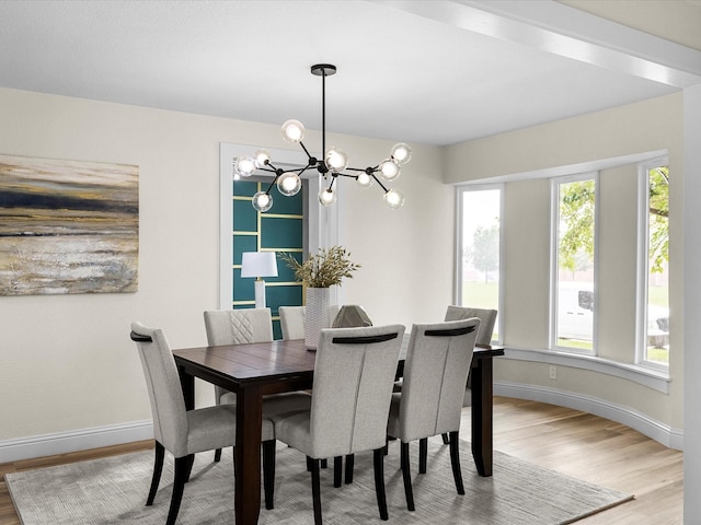 6622 Symphony Dr, Dallas, TX 75227 - dining space with a chandelier, wood finished floors, and baseboards