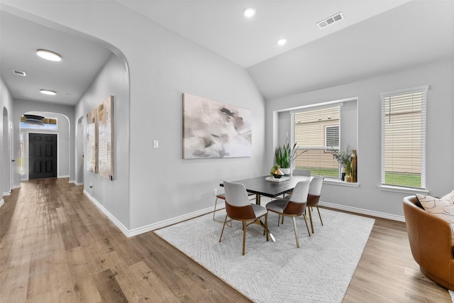 1412 Inks Dr, Desoto, TX 75115 - dining space with arched walkways, wood finished floors, vaulted ceiling, baseboards, and recessed lighting