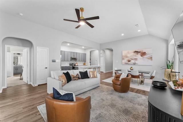 1412 Inks Dr, Desoto, TX 75115 - living room featuring arched walkways, a ceiling fan, wood finished floors, vaulted ceiling, and recessed lighting