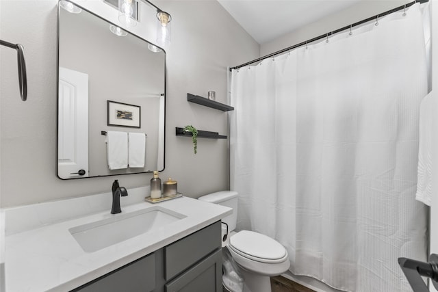 1412 Inks Dr, Desoto, TX 75115 - bathroom featuring toilet, vanity, and a shower with shower curtain