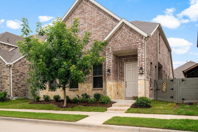 5415 Waterloo Dr, Sachse, TX 75048 - view of front of property featuring brick siding, a shingled roof, and stone siding