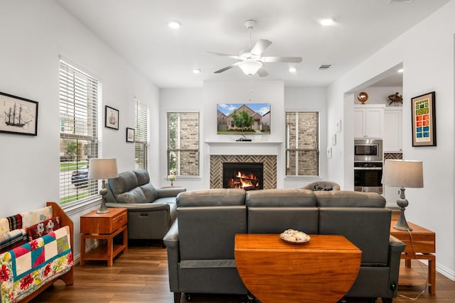 5415 Waterloo Dr, Sachse, TX 75048 - living area featuring ceiling fan, wood finished floors, a tile fireplace, and recessed lighting
