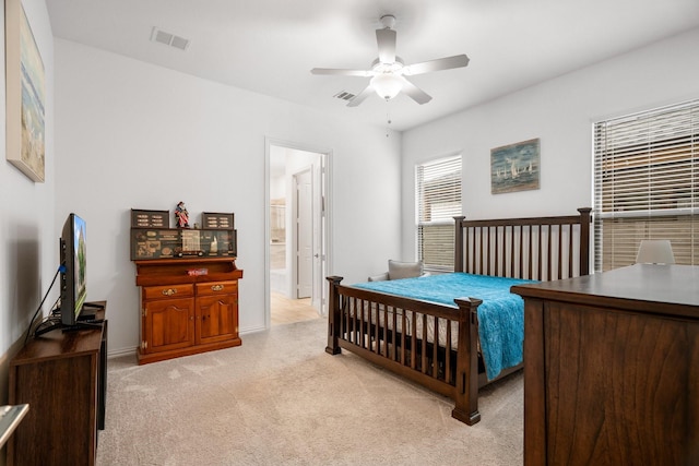 5415 Waterloo Dr, Sachse, TX 75048 - bedroom featuring light carpet, baseboards, connected bathroom, and ceiling fan