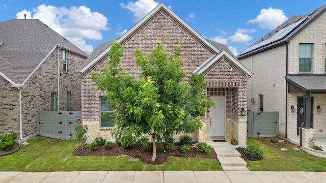 5415 Waterloo Dr, Sachse, TX 75048 - view of front facade with a gate, brick siding, and stone siding