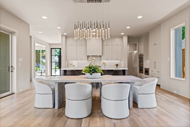 7718 Morton St, Dallas, TX 75209 - dining room featuring light wood-type flooring and recessed lighting