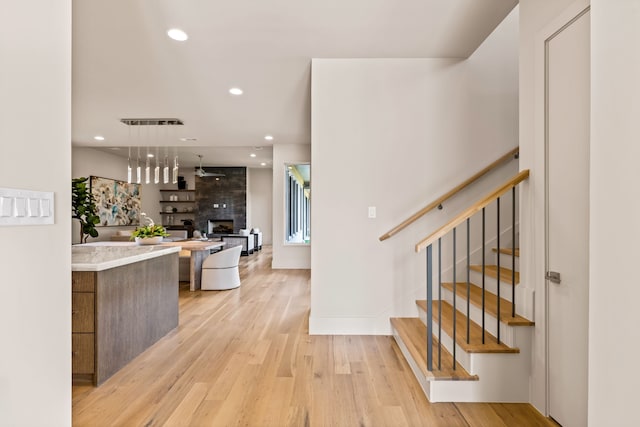 7718 Morton St, Dallas, TX 75209 - kitchen with light wood-style floors, light countertops, recessed lighting, modern cabinets, and open floor plan