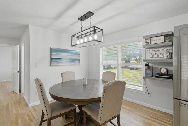 613 Crestview Dr, Granbury, TX 76048 - dining room with light wood-style floors and baseboards