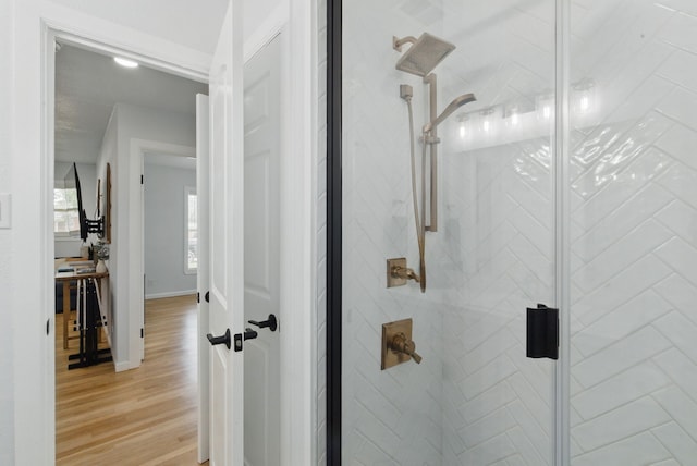 613 Crestview Dr, Granbury, TX 76048 - full bathroom featuring a stall shower and wood finished floors