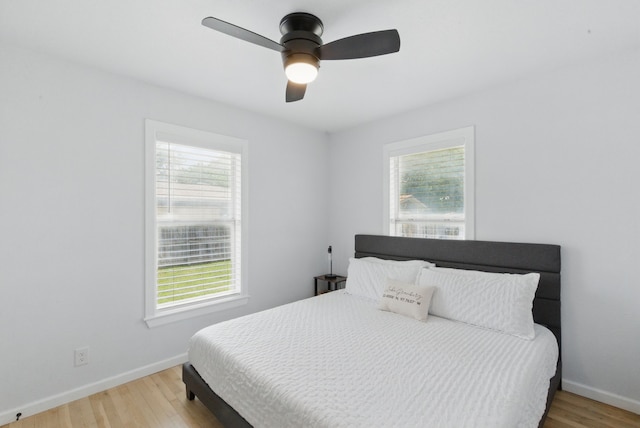 613 Crestview Dr, Granbury, TX 76048 - bedroom with multiple windows, light wood-type flooring, baseboards, and a ceiling fan