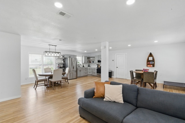 613 Crestview Dr, Granbury, TX 76048 - living room with recessed lighting, baseboards, and light wood-style flooring