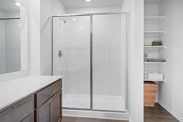 1416 Old Trail Rd, Royse City, TX 75189 - bathroom featuring wood finished floors, a shower stall, vanity, baseboards, and recessed lighting