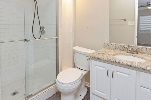 745 Cambridge Dr, Plano, TX 75023 - full bathroom featuring a shower stall, toilet, vanity, and a ceiling fan
