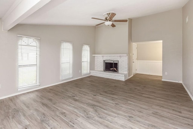 745 Cambridge Dr, Plano, TX 75023 - unfurnished living room with ceiling fan, plenty of natural light, a brick fireplace, and wood finished floors