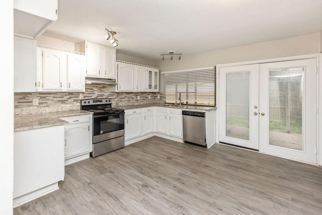 745 Cambridge Dr, Plano, TX 75023 - kitchen featuring stainless steel appliances, under cabinet range hood, white cabinetry, and a sink