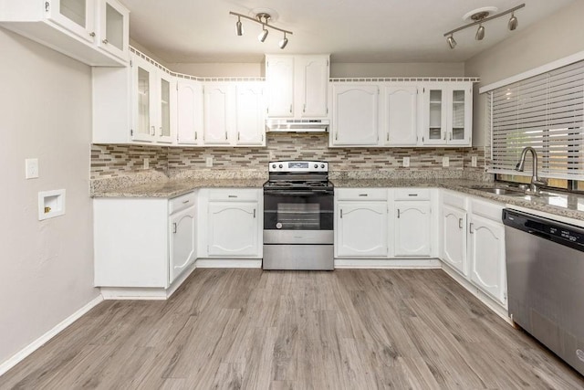 745 Cambridge Dr, Plano, TX 75023 - kitchen featuring appliances with stainless steel finishes, a sink, under cabinet range hood, and white cabinets