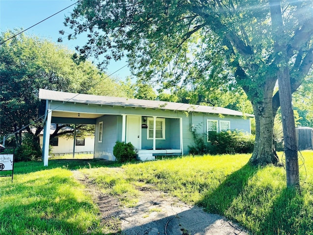 301 Beckham St E, Sulphur Springs, TX 75482 - bungalow-style house with covered porch, a carport, and a front yard