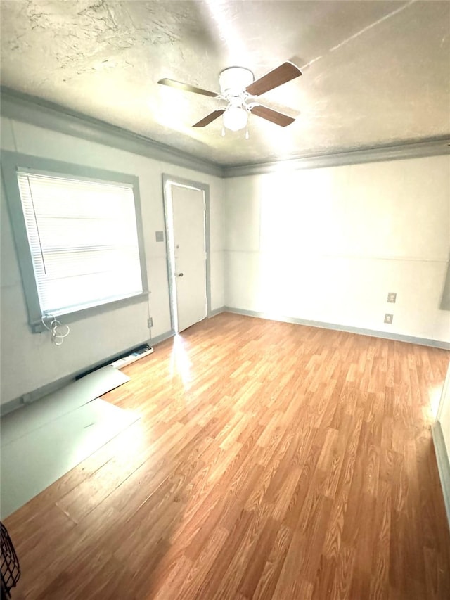 301 Beckham St E, Sulphur Springs, TX 75482 - unfurnished room with light wood-type flooring, ceiling fan, and baseboards