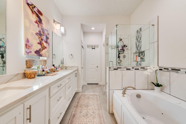 391 E Lamar St, Royse City, TX 75189 - bathroom with a stall shower, a jetted tub, and double vanity