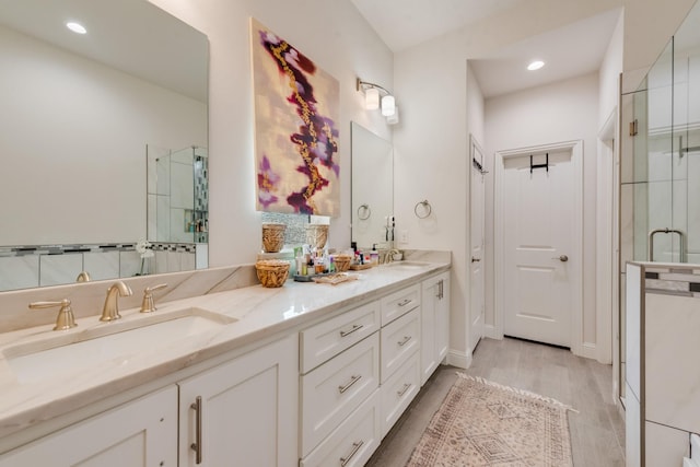 391 E Lamar St, Royse City, TX 75189 - bathroom with a shower stall, double vanity, recessed lighting, and wood finished floors
