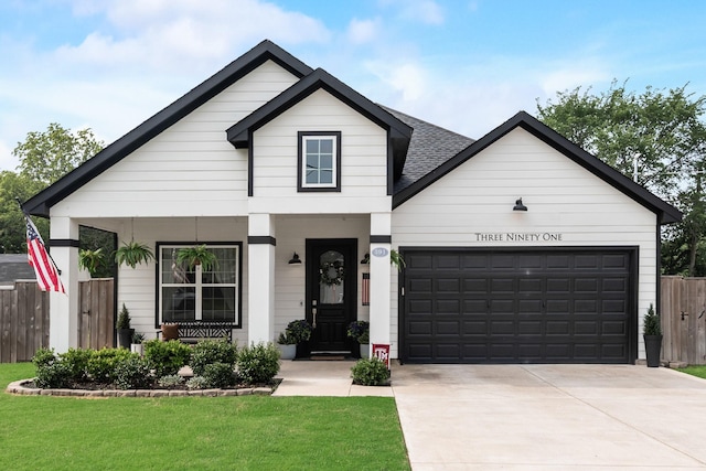 391 E Lamar St, Royse City, TX 75189 - view of front facade with a garage, concrete driveway, and roof with shingles