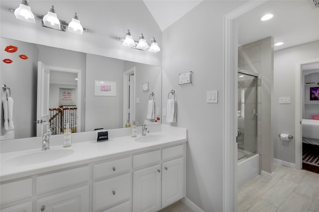 full bathroom featuring recessed lighting, double vanity, baseboards, and connected bathroom