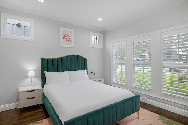 bedroom featuring crown molding, dark wood-type flooring, recessed lighting, and baseboards