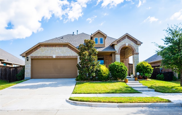 3031 Concourse Dr, Royse City, TX 75189 - view of front of home featuring brick siding, a garage, driveway, and roof with shingles