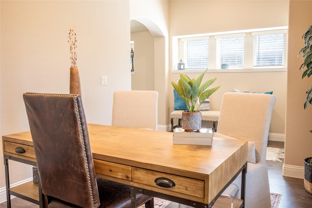 3031 Concourse Dr, Royse City, TX 75189 - dining area featuring arched walkways, dark wood-type flooring, and baseboards